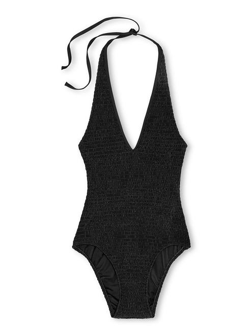 Classic silhouettes, like halter necklines, are a no-fail option. Lands' End Women's Smocked One Piece Swimsuit, 00-12, $59.99.