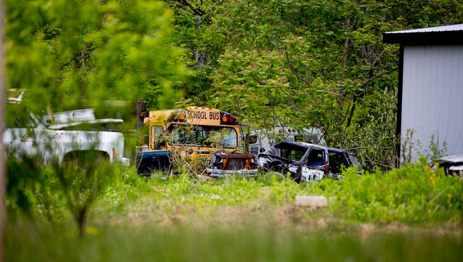 May 17, 2016: Old cars and buses are seen Tuesday on the property where Christopher Rhoden Sr and his cousin Gary Rhoden were found shot and killed. Christopher Sr.'s mobile home was seized by the Pike County Sheriff and the Ohio Bureau of Criminal Investigations.

After more than three weeks of gathering evidence in the April 22 killings that left seven family members and a fiancee dead, authorities have released the Rhoden properties on Union Hill and Union roads to surviving relatives.

Authorities released the property back to the families late Monday, said Dan Tierney, spokesman for the Ohio Attorney GeneralÕs office.