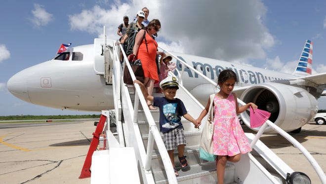 Fliers arrive in Cienfuegos, Cuba, on American Airlines inaugural scheduled service from Miami to Cuba on Sept. 7, 2016.