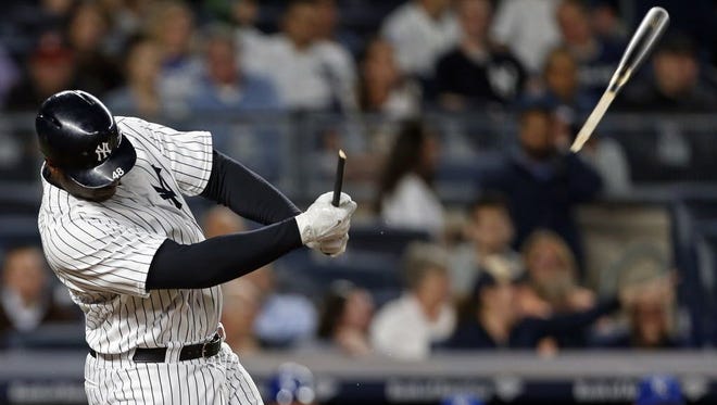 New York Yankees first baseman Chris Carter's bat breaks during the seventh inning against the Kansas City Royals.
