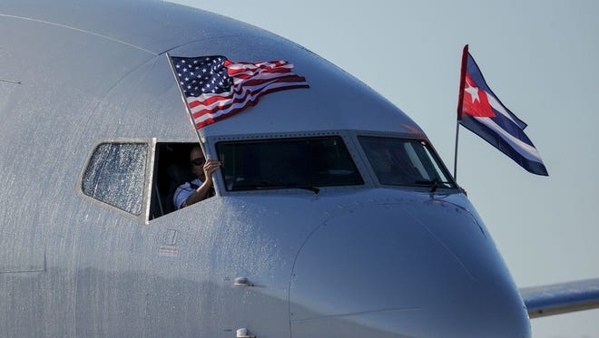 An American Airlines plane arrives at Havana's Jose Marti International Airport on Monday, Nov. 28, 2016, to become the first regular U.S. airline flight to Havana in 50 years.
