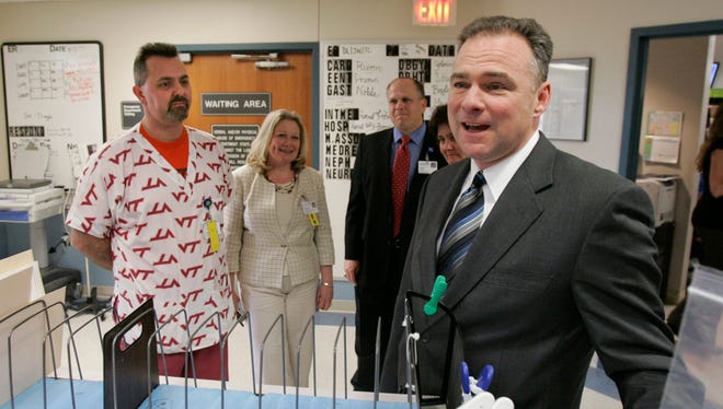 Kaine greets the staff of the Montgomery Regional Hospital along with director of the emergency room, Dr. Mike Hill, left, in Blacksburg, Va., on April 18, 2007, as he visited some of the wounded students from the Virginia Tech shooting.