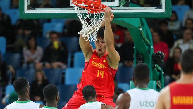 Spain center Guillermo Hernangomez Geuer (14) dunks over Nigeria defense during the men's preliminary round in the Rio 2016 Summer Olympic Games at Carioca Arena 1.