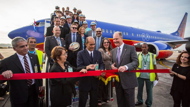 Southwest Airlines CEO Gary Kelly (right) is seen with officials and employees as the carrier made its  maiden flight to Havana, Cuba, on Dec. 12, 2016.