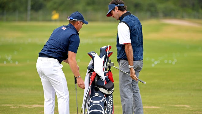 Danny Willett of Great Britain, left, talks with Bubba Watson of the United States on the prior to the first round of the men's golf in the Rio 2016 Summer Olympic Games at Olympic Golf Course.