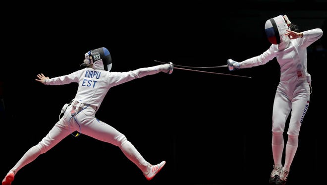 Erika Kirpu (EST) competes against Lyubov Shutova (RUS) during the women's epee team bronze medal match at Carioca Arena 3 in the Rio 2016 Summer Olympic Games.