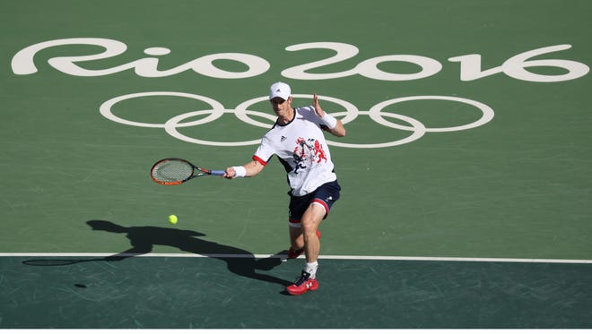 Andy Murray of Great Britain returns during his match against Fabio Fognini of Italy in the tennis singles competition in the Rio 2016 Summer Olympic Games at Olympic Tennis Centre.