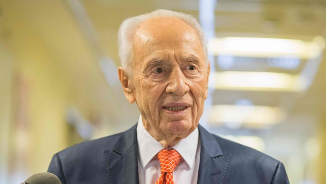 This file photo taken on Jan. 19, 2016 shows former Israeli president and Nobel Peace Prize winner Shimon Peres addressing journalists at the Tel Ashomer Hospital in Ramat Gan, near Tel Aviv, after treatment for a heart problem.