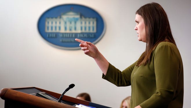Sanders points to a questioner during an off-camera press briefing at the White House on July 18, 2017.
