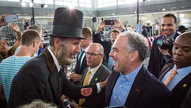 Abe Lincoln impersonator Lance Mack of Marion, Iowa, greets Kaine after a rally on Aug. 17, 2016, in Cedar Rapids, Iowa.