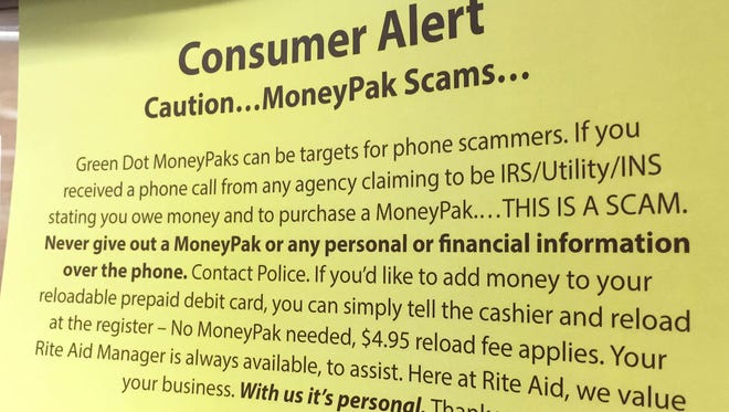 Consumers are warned at some stores not to fall for phone scammers demanding payments on Green Dot MoneyPak cards.