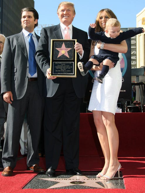 Donald Trump, then the producer of NBC's "The Apprentice," poses with his family -- son Donald Jr., wife Melania and their son Barron -- after he was honored with the 2,327th star on the Hollywood Walk of Fame on Hollywood Boulevard on Jan. 16, 2007.