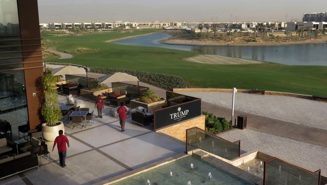 In this Wednesday, Aug. 9, 2017 photo, staff prepare the dinning area at the Trump International Golf Club clubhouse in Dubai, United Arab Emirates. A Dubai billionaire who built a Trump golf course in the United Arab Emirates now wants to seek more business abroad. Hussain Sajwanis recent trips to Croatia and Malta more resembled visits by a head of state than those of a real estate developer. President Donald Trump's sons arrived in the UAE for an invitation-only ceremony Saturday to formally open the club. Secret Service traveled with the Trumps.