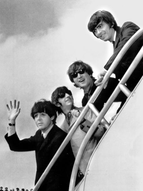 Ron Howard's new Beatles documentary, 'Eight Days a Week: The Touring Years,' is heading to theaters (Sept. 16) and Hulu (Sept. 17). Here, the Fab Four have a ticket to ride from New York to England in 1964. From left: Paul McCartney, Ringo Starr, John Lennon and George Harrison.