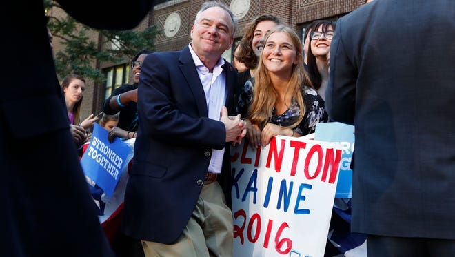 Kaine poses with the audience after a campaign rally at the University of Michigan in Ann Arbor, Mich., on Sept. 13, 2016.