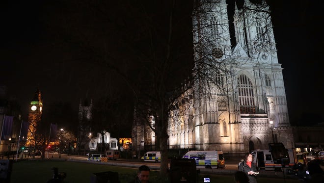 Reporters and emergency services are pictured outside Westminster Abbey next to the Houses of Parliament after Wednesday's attack in London.