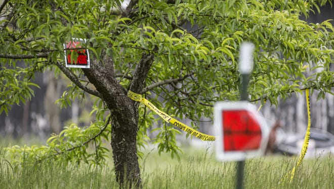 May 17, 2016: "No Trespassing" signs are visible on the property where Christopher Rhoden Sr. and Gary Rhoden were found shot and killed.