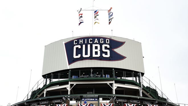 A Cubs fan died Wednesday after falling over a Wrigley Field railing on Tuesday night.