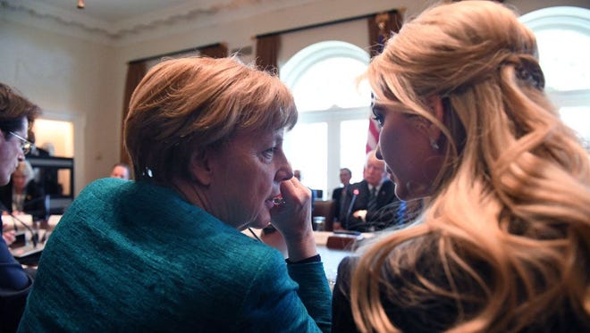German Chancellor Angela Merkel, left. speaks with Ivanka Trump during a roundtable discussion on vocational training with United States and German business leaders in the Cabinet Room of the White House on March 17, 2017.