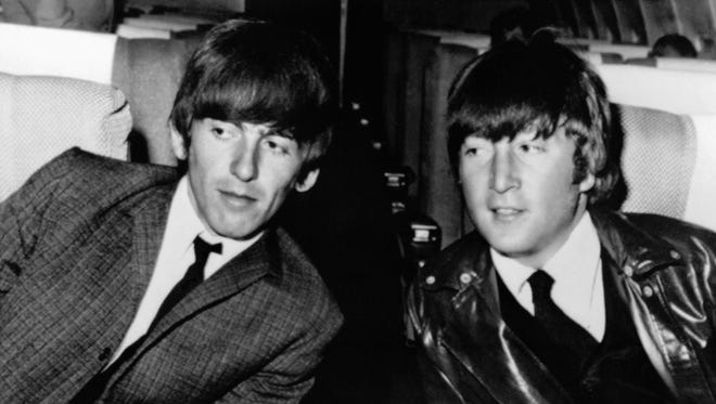 George Harrison, left, and John Lennon aboard an airplane in Los Angeles before leaving for London on May 25, 1964. "The idea that the audience they were playing to was each other became more extreme as they got more isolated," Sinclair says. "So what mattered was, did John Lennon laugh at my joke?"