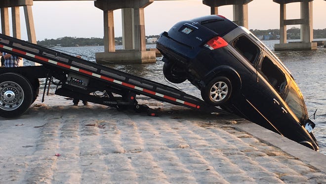 A Nissan Quest minivan that had been submerged in the Indian River by its driver was pulled from the water Saturday.