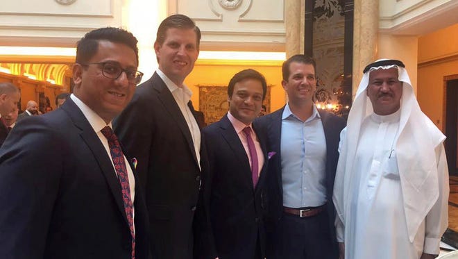 Banke International director Niraj Masand, far left, poses for a photo with Eric Trump, second left, Banke International director Porush Jhunjhunwala, center, Donald Trump Jr., second right, and DAMAC Properties chairman Hussain Sajwani, during festivities marking the formal opening of the Trump International Golf Club, in Dubai, United Arab Emirates on Feb. 18, 2017. Two of U.S. President Donald Trump's sons arrived in the UAE for an invitation-only ceremony Saturday to formally open the club.