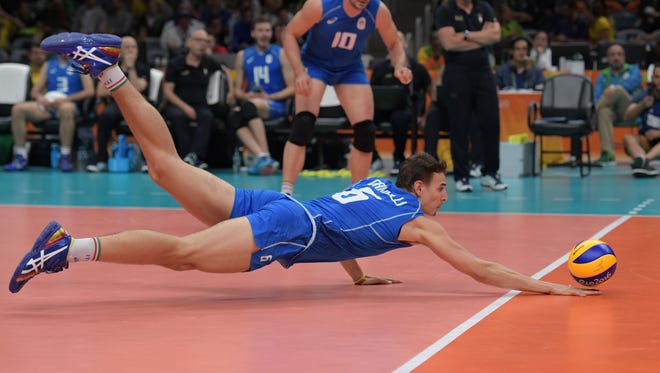 Italy setter Simone Giannelli (6) digs the ball against Mexico during the men's preliminary in the Rio 2016 Summer Olympic Games at Maracanazinho.