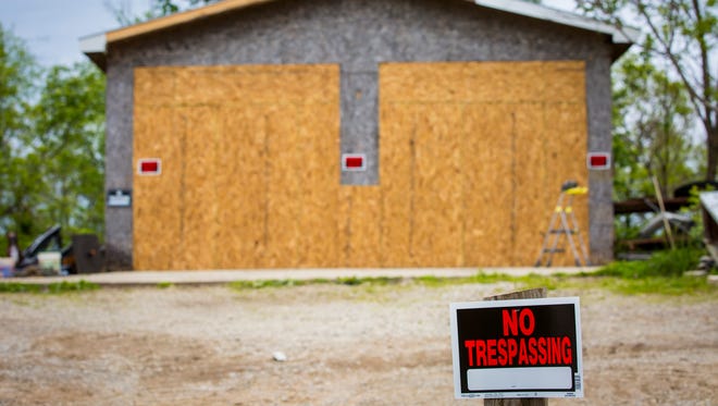 May 17, 2016: "No Trespassing" signs are visible Tuesday on the property where Christopher Rhoden Sr and Gary Rhoden were found shot and killed. Christopher Sr.'s mobile home was seized by the Pike County Sheriff and the Ohio Bureau of Criminal Investigations.

After more than three weeks of gathering evidence in the April 22 killings that left seven family members and a fiancee dead, authorities have released the Rhoden properties on Union Hill and Union roads to surviving relatives.

Authorities released the property back to the families late Monday, said Dan Tierney, spokesman for the Ohio Attorney GeneralÕs office.