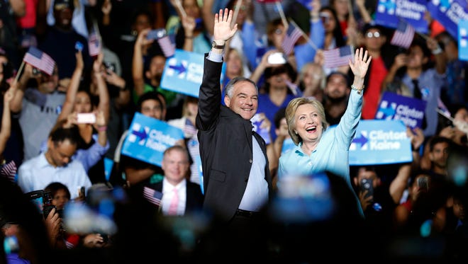 Hillary Clinton arrives with Kaine at a rally at Florida International University Panther Arena in Miami on July 23, 2016.