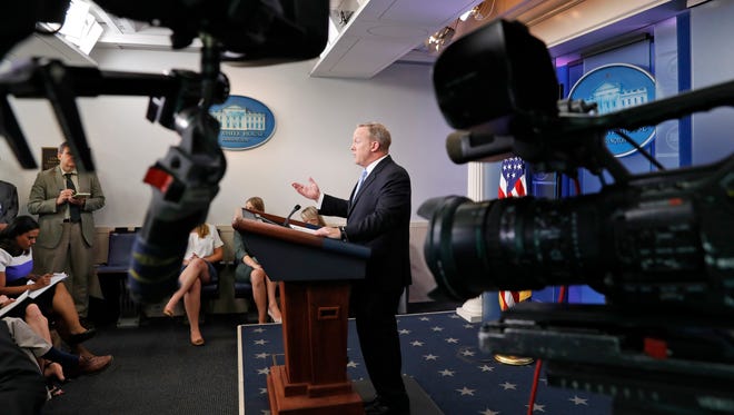 Spicer speaks as cameras are pointed away during an off-camera media briefing at the White House on June 26, 2017.