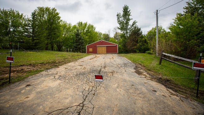 May 17, 2016: A garage is boarded up Tuesday on the property where Dana Rhoden and her two children, Hanna Rhoden and Chris Rhoden, Jr. were found shot and killed. Her mobile home and its additions were removed and seized by the Pike County Sheriff and the Ohio Bureau of Criminal Investigations.

After more than three weeks of gathering evidence in the April 22 killings that left seven family members and a fiancee dead, authorities have released the Rhoden properties on Union Hill and Union roads to surviving relatives.

Authorities released the property back to the families late Monday, said Dan Tierney, spokesman for the Ohio Attorney GeneralÕs office.