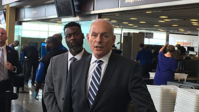 John Kelly, right, secretary of the Department of Homeland Security, speaks May 26, 2017, about aviation security at Washington Reagan National Airport with federal security director Kerwin Wilson.