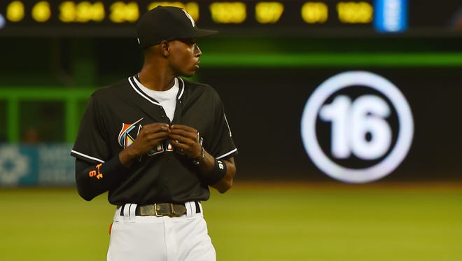 Marlins second baseman Dee Gordon walks on the field before the game against the Mets at Marlins Park.