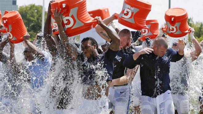 Tennessee Titans players take part in the ALS Ice Bucket Challenge after NFL football practice in Nashville.