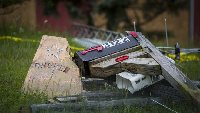 May 17, 2016: A pile of mailboxes is visible from the road Tuesday, on the property where Dana Rhoden and her two children, Hanna Rhoden and Chris Rhoden, Jr. were found shot and killed.