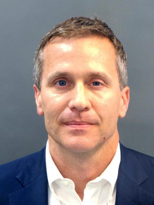 A booking photo provided by the St. Louis Metropolitan Police Department shows Missouri Gov. Eric Greitens on Thursday, Feb. 22, 2018.  A St. Louis grand jury indicted Greitens on a felony invasion of privacy charge for allegedly taking a compromising photo of a woman with whom he had an affair in 2015, the city circuit attorney's office said. Greitens' attorney issued a scathing statement challenging the indictment.MOSTP321