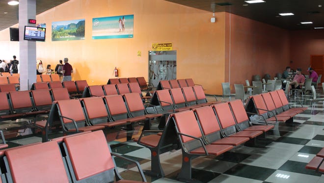 After clearing immigration and security there is plenty of room to sit, but little else in the way of amenities in the terminal at the Santa Clara airport.