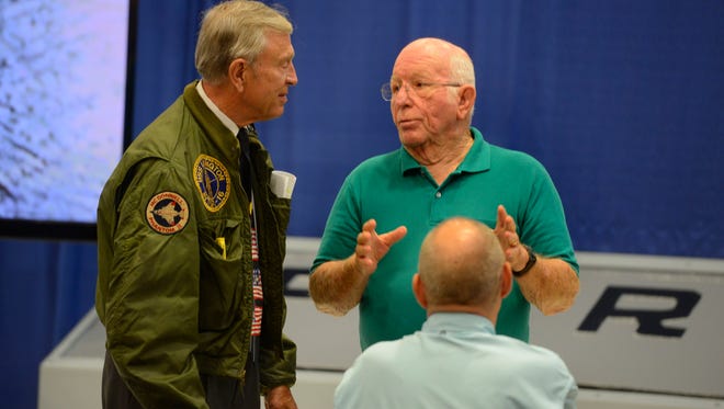 Retired Navy Captain C. Flack Logan chats with Bob Loewen, who was also aboard the USS Forrestal in 1967 when the fire broke out. Logan  and Loewen were part of the 50th anniversary commemoration ceremony at the National Naval Aviation Museum Saturday, July 29, 2017.