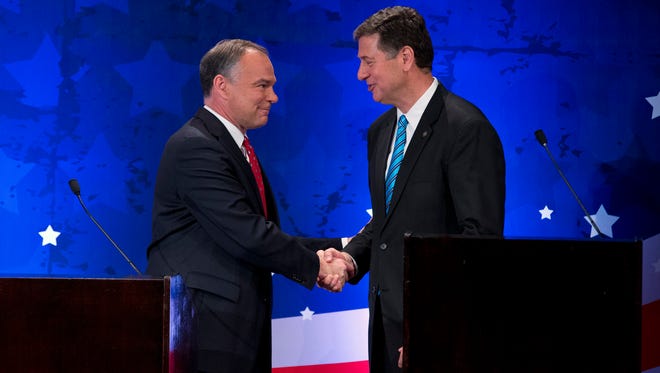 Kaine and Republican candidate George Allen shake hands during a senatorial debate in McLean, Va., on Sept. 20, 2012.