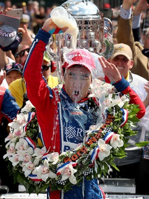 Andretti Autosport IndyCar driver Takuma Sato (26) celebrates winning the 101st running of the Indianapolis 500 at Indianapolis Motor Speedway Sunday, May 28, 2017.