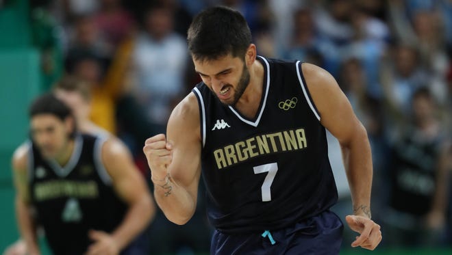Argentina point guard Facundo Campazzo (7) reacts during the men's preliminary round against Lithuania.