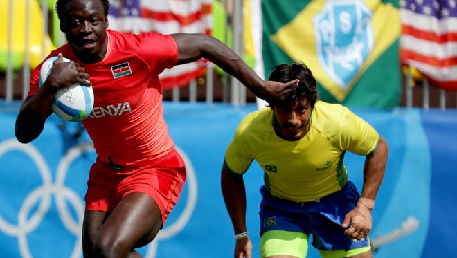 Billy Odhiambo of Kenya breaks away for a try during a rugby sevens match against Brazil at Deodoro Stadium in the Rio 2016 Summer Olympic Games.