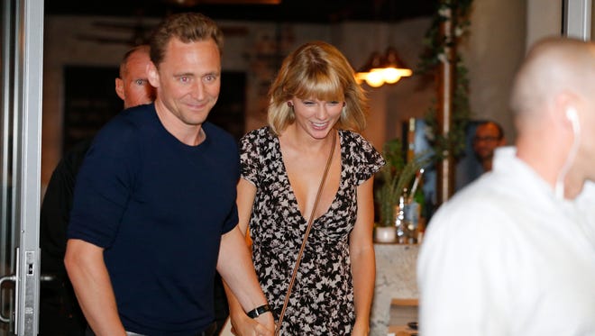 Tom Hiddleston and Taylor Swift leave a restaurant in Broadbeach on the Gold Coast, Queensland, Australia on July 10, 2016.
