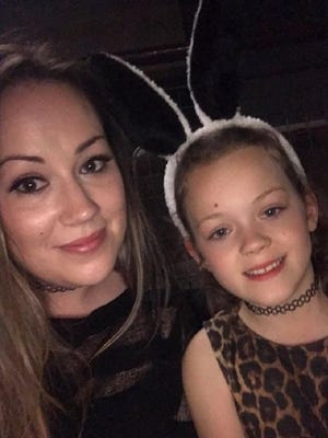 Rebecca Reeton with daughter Lillian at the Ariana Grande concert in Manchester, England.