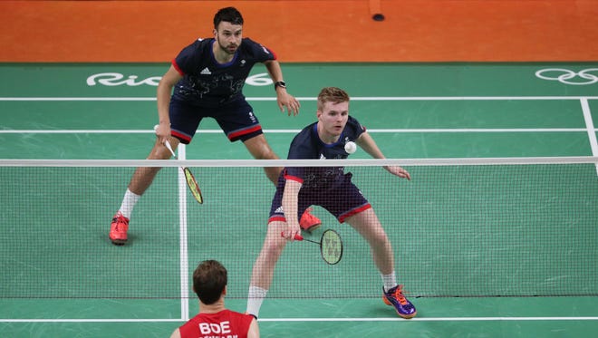 Marcus Ellis (GBR) and Chris Langridge (GBR) compete against Denmark during the men's doubles in the Rio 2016 Summer Olympic Games at Riocentro - Pavilion 4.