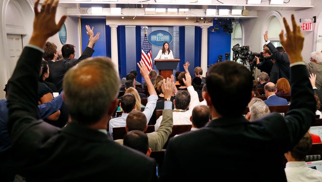 Sanders faces questions from reporters during an off-camera press briefing at the White House on July 12, 2017.