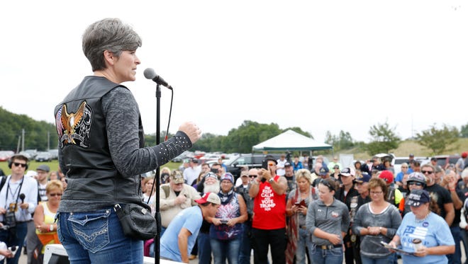 Sen. Joni Ernst thanks participants for coming out Saturday, Aug. 27, 2016, as they get ready to head out from the Big Barn Harley Davidson dealership to the Iowa State Fairgrounds for the second annual Roast and Ride in Des Moines.