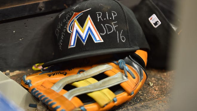 Marcell Ozuna's hat with Jose Fernandez's initials on it.