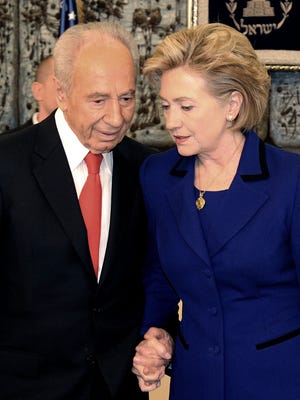 A handout image provided by the Israeli Government Press Office and made availabe on Sept. 28 shows then Israel President Shimon Peres in a conference with then U.S. Secretary of State Hilary Clinton in Israel, 03/03/2009.