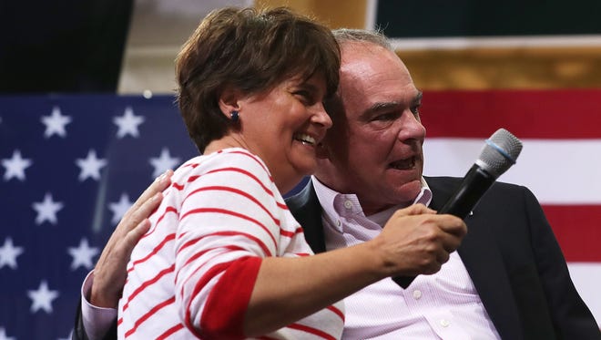 Kaine and his wife, Anne Holton, acknowledge the crowd during a campaign event on Aug. 1, 2016, in Richmond, Va.